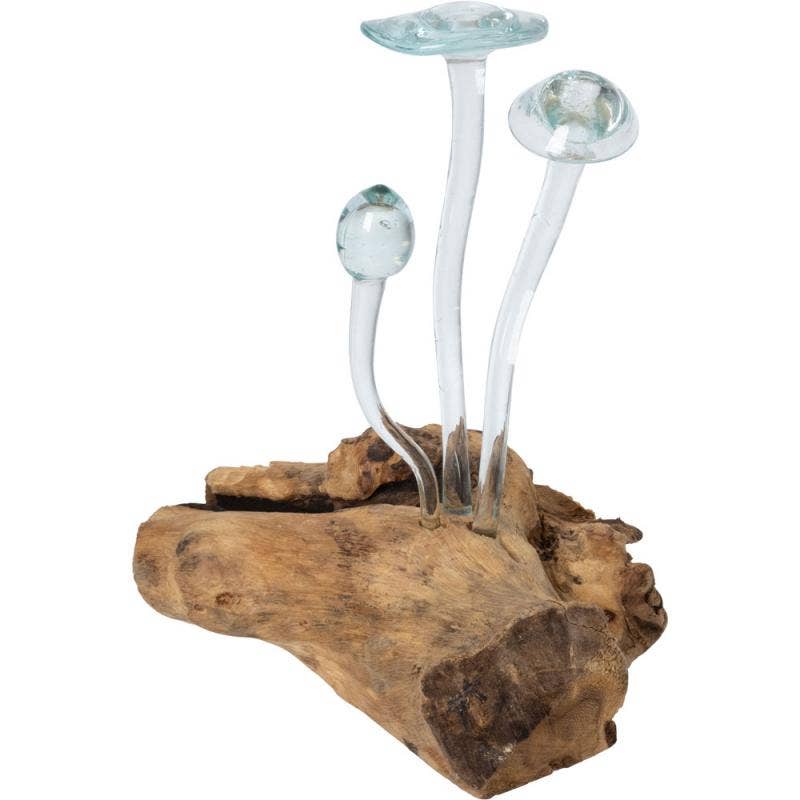 THREE MOLTEN GLASS MUSHROOMS ON DRIFTWOOD